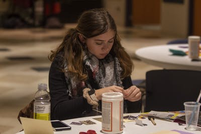 Freshman Elizabeth Algeri makes a craft Jan. 23 in the Willkie Auditorium. The Art of Resistance: Past and Present honored Martin Luther King Jr. and the history of black resistance.