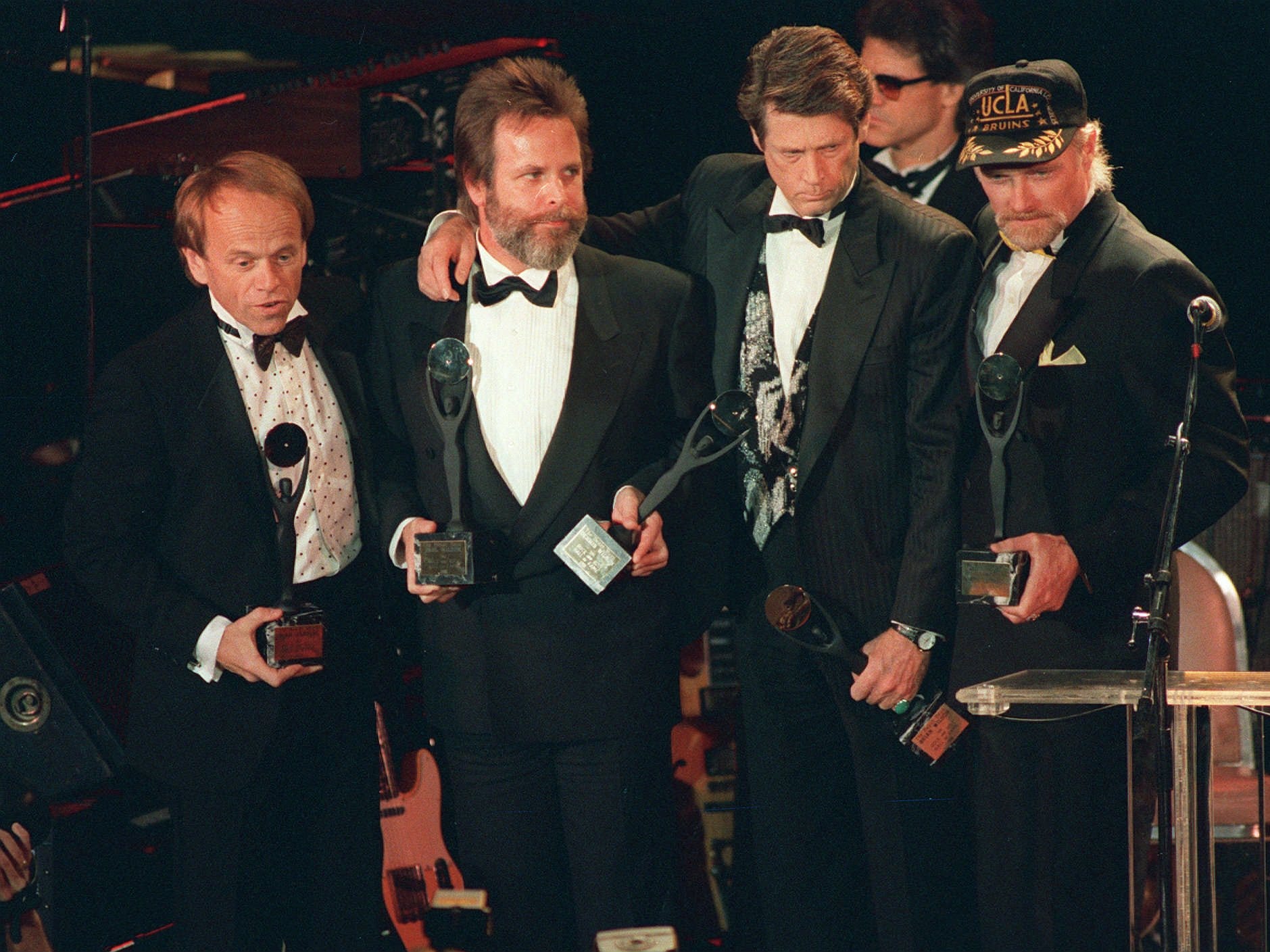 The Rock 'n' Roll group the Beach Boys hold their trophies after being inducted into the Rock 'n' Roll Hall of Fame in New York in this Jan. 21, 1988 file photo. Al Jardine, far left, is from Rochester. Next to him is Carl Wilson, Brian Wilson and Mike Love.