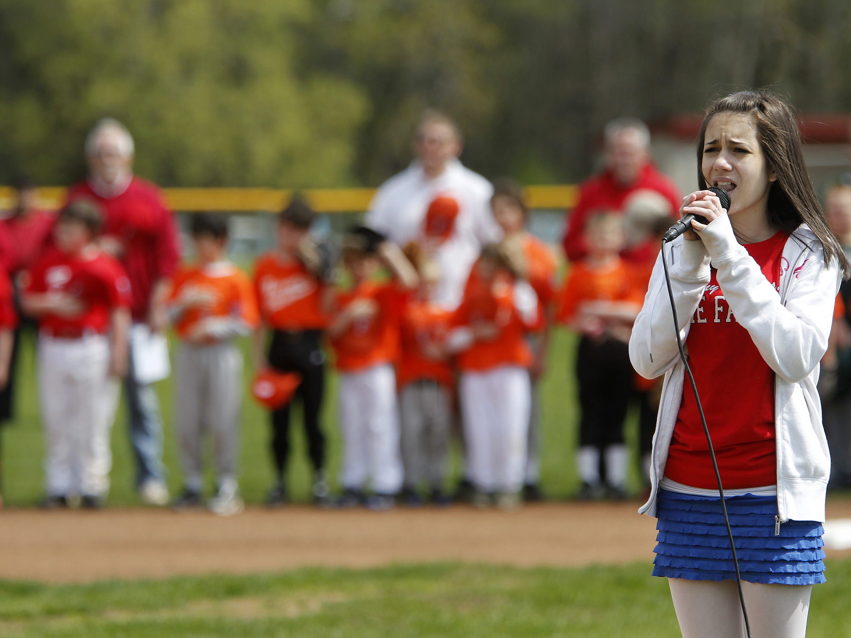 The 13 year old version of pop singer Aviella Winder, of Fairport. She sang the national anthem during the opening day of Fairport Little League Saturday afternoon, May 7, 2011.