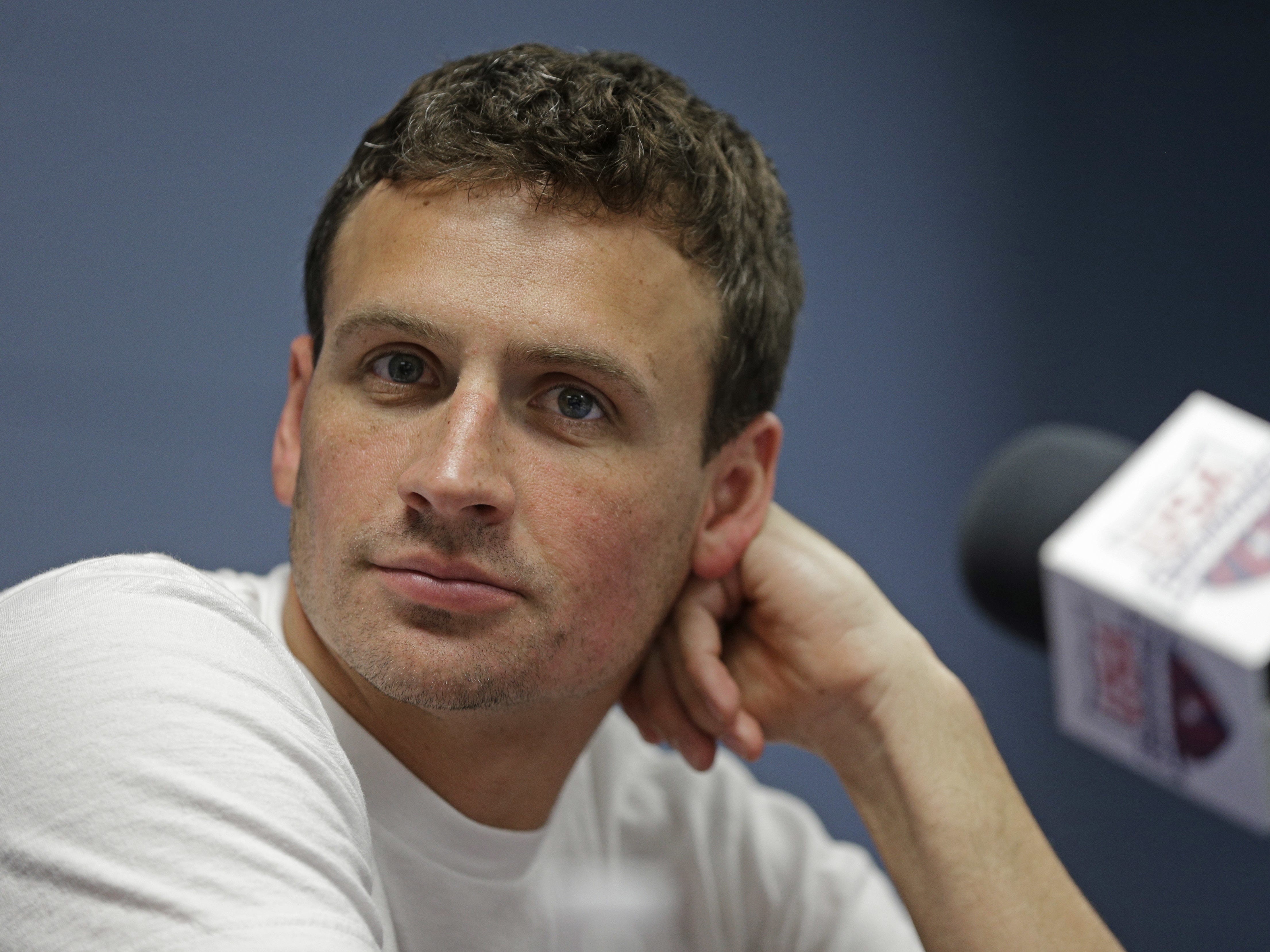 In this May 12, 2016, file photo, swimmer Ryan Lochte, 12-time Olympic medalist, listens to a question from the media in Charlotte, N.C.