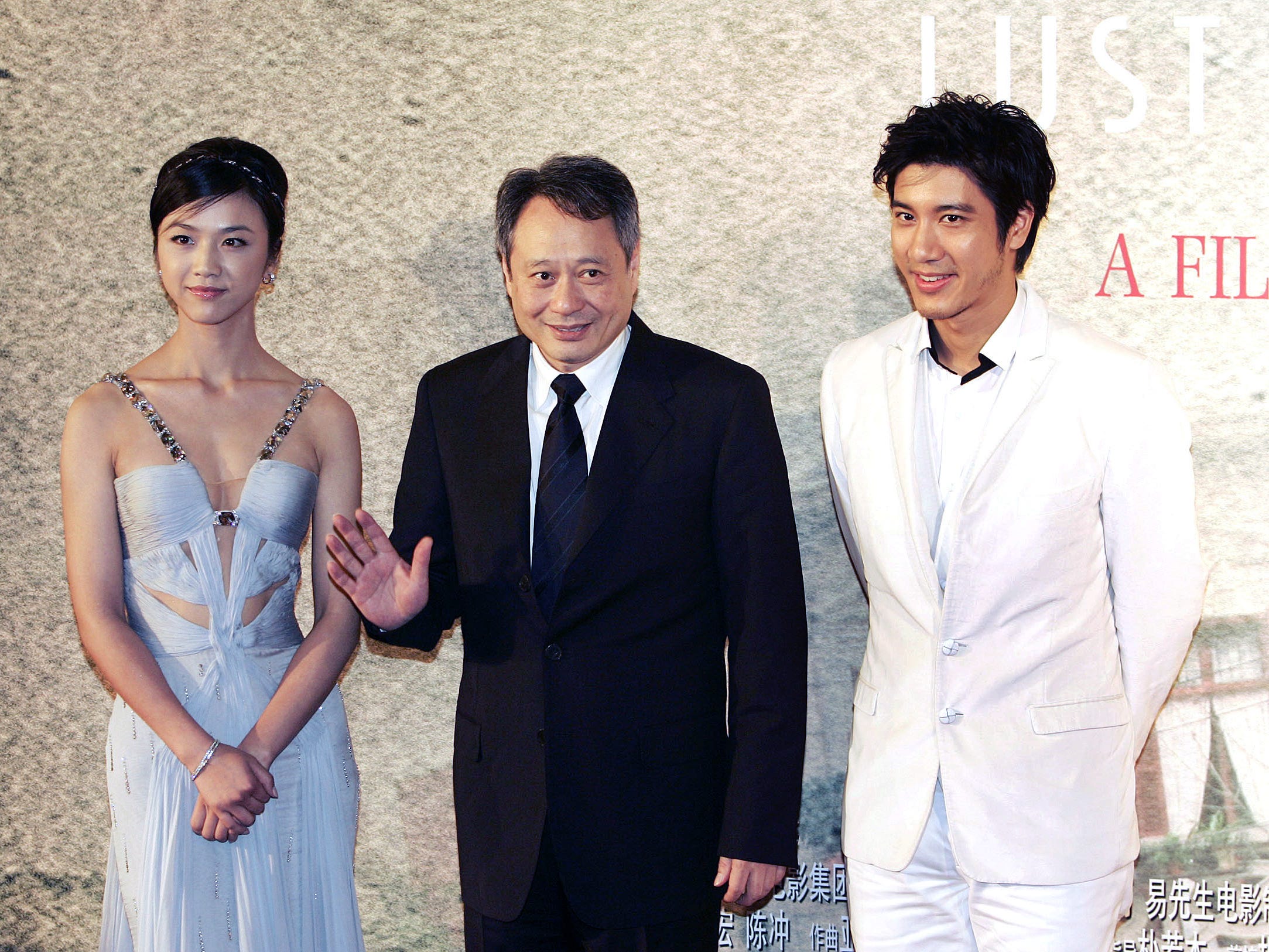 Wang Leehom, right, of Rochester, stands with Director Ang Lee, center, and Chinese actress Tang Wei, left, before the premiere of their film "Lust, Caution," at the Shanghai Film Center in Shanghai, China on Oct. 31, 2007.