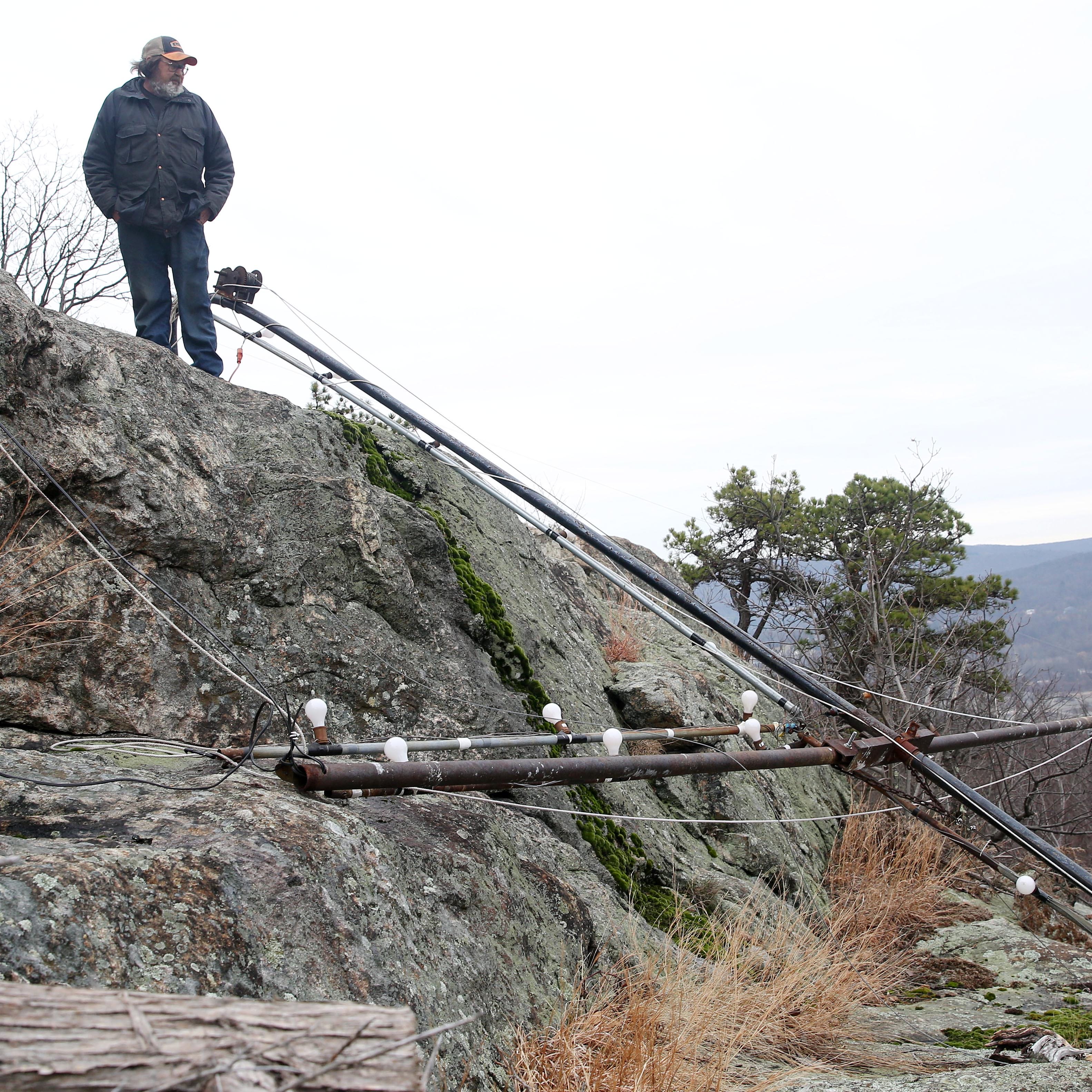 James A. Brooks look over the cross that once stood on Honness Mountain off Interstate 84 in Fishkill Jan. 3, 2020. The cross was taken down by vandals on Thursday, he said.