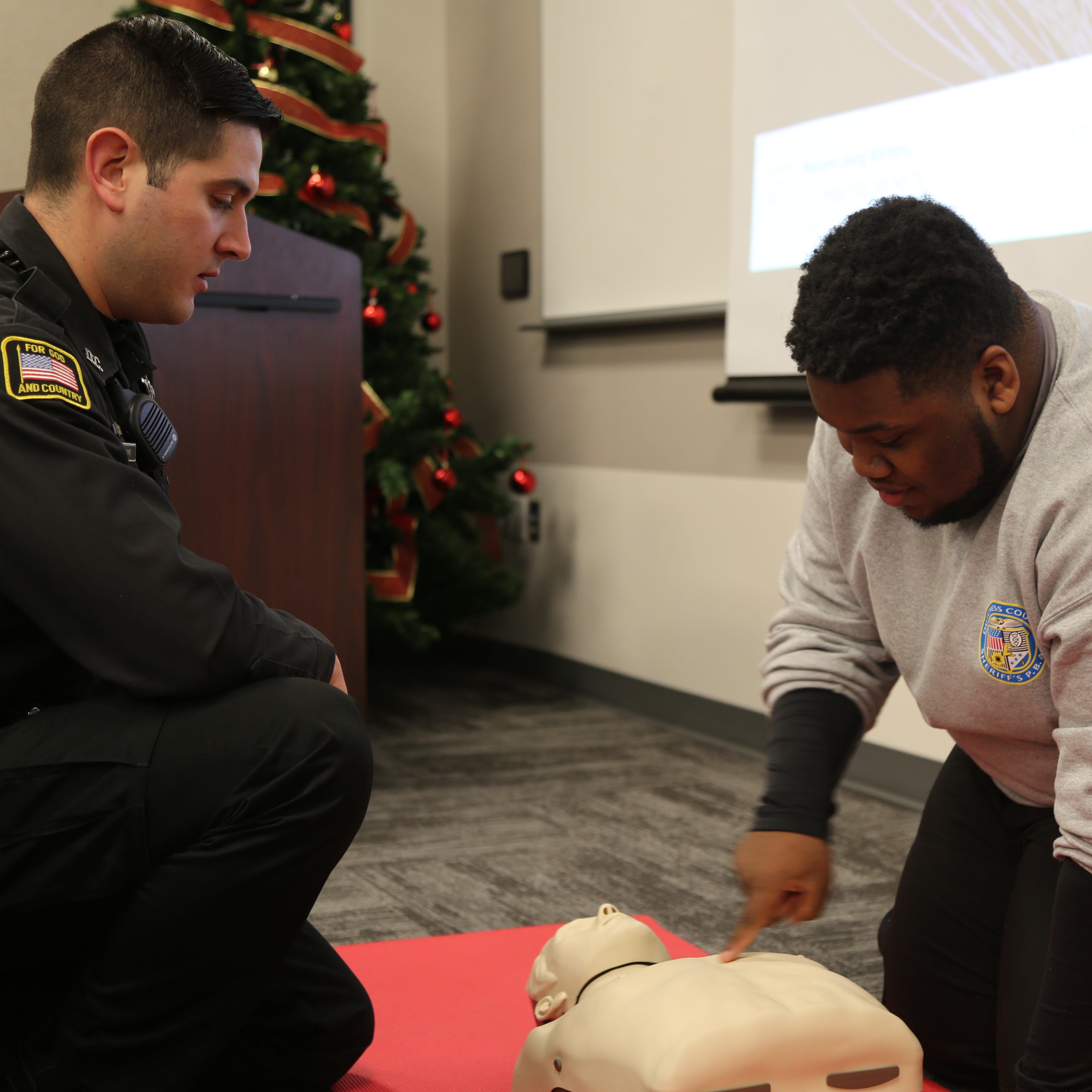 Deputy Blake Williams watched as Brandon Anderson, a Junior at Franklin D. Roosevelt High School practiced CPR.