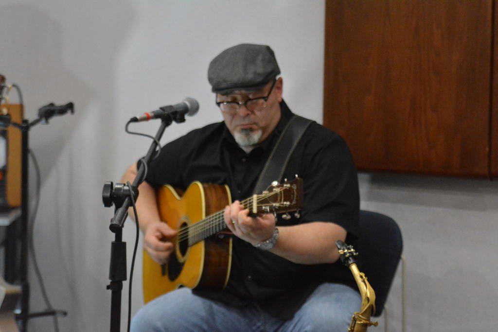 Heath Alan performed on a variety of instruments during the first event of the Blues Under the Blue Roof series at the Newton Public Library Monday evening.