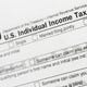 FILE - This July 24, 2018, file photo shows a portion of the 1040 U.S. Individual Income Tax Return form. The IRS began accepting and processing tax returns for individuals on Monday, Jan. 27, 2020. (AP Photo/Mark Lennihan, File)