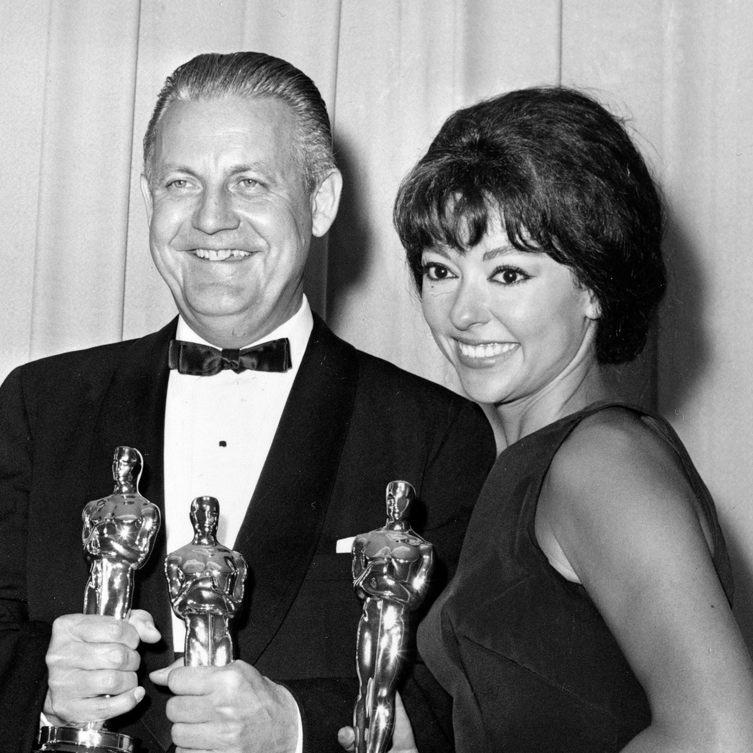 In this April 9, 1962 file photo, Oscar winners for "West Side Story," Robert Wise, and actress Rita Moreno, pose at the Academy Awards in Santa Monica, Calif. 