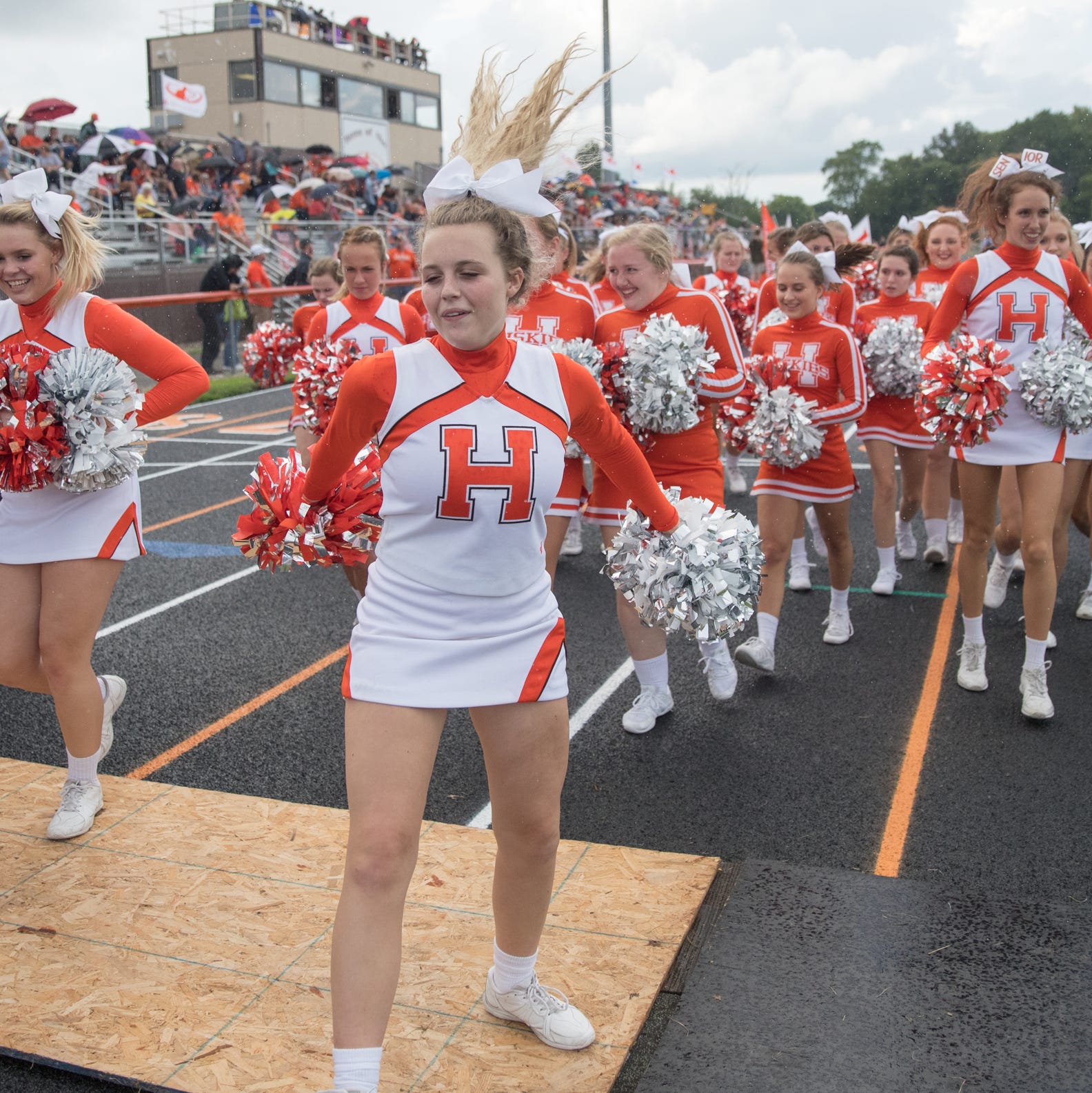 Hamilton Heights High School cheerleaders jump into place before game action, Mount Vernon High School at Hamilton Heights High School football, won by MVHS, 43-14, Arcadia, Friday, Aug. 17, 2018. This game is the first for HHHS head coach Jon Kirschner, who faced his father Mike Kirschner, a veteran and champion coach in his first season at MVHS. 