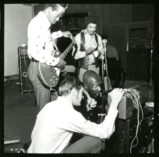 Harold Beane, with guitar, working with Isaac Hayes.