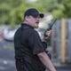 A private security guard who works for the apartment complex calls for backup as members of the media attempt to get closer to the crime scene.