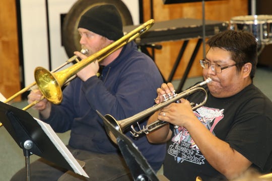 Delbert Anderson, right, was a high school trumpet player when he was spotted performing at the San Juan College Jazz Festival in the early 2000s by Chris Beaty.