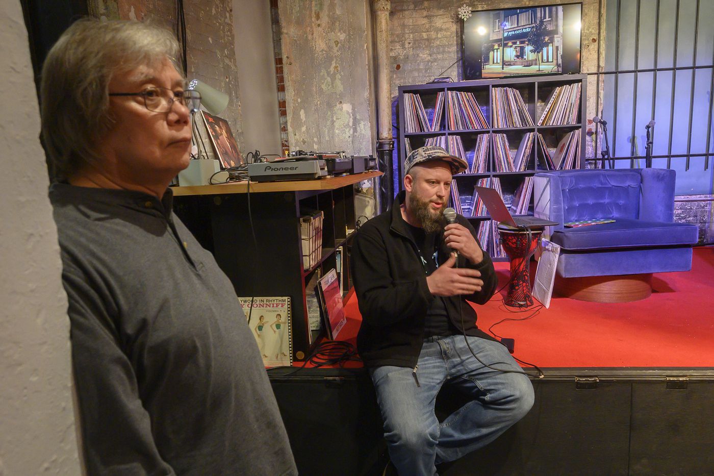 Max Ochester of Brewerytown Beats (right, sitting) along with former Sigma Sound Studios engineer Arthur Stoppe take part in a brainstorming meeting with old Sigma employees, some younger music people and preservationists who want to try and save the old studio's 212 N. 12th Street building. The meeting took place Wednesday night at The Spring Arts Building in the Callowhill neighborhood of Philadelphia, March 4, 2020. Avi Steinhardt / For the Inquirer