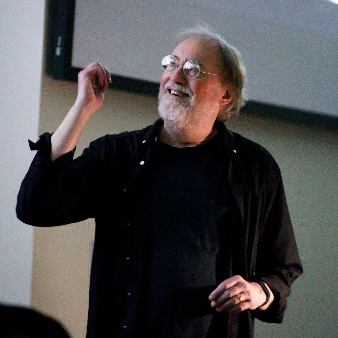 Glenn Gass reacts with a smile during a lecture