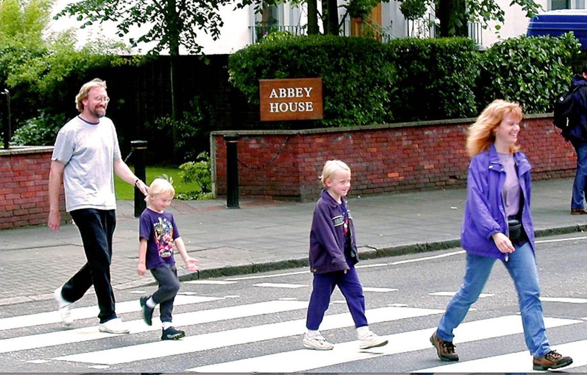 Glenn and his family walking across Abbey Road