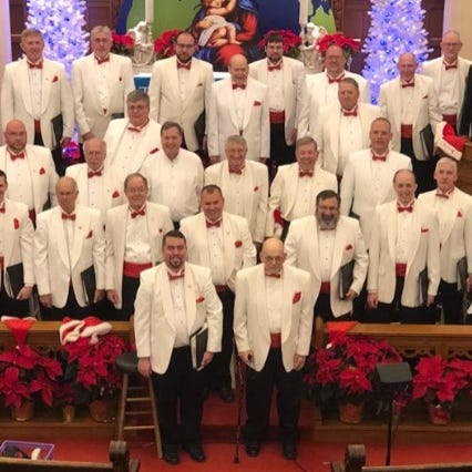 The Lancaster Men's Chorus poses for a photo before their Christmas concert in December 2019. David Alexander, a 2nd tenor, is raising money for the group's scholarship fund by running 26.2 miles this Sunday.