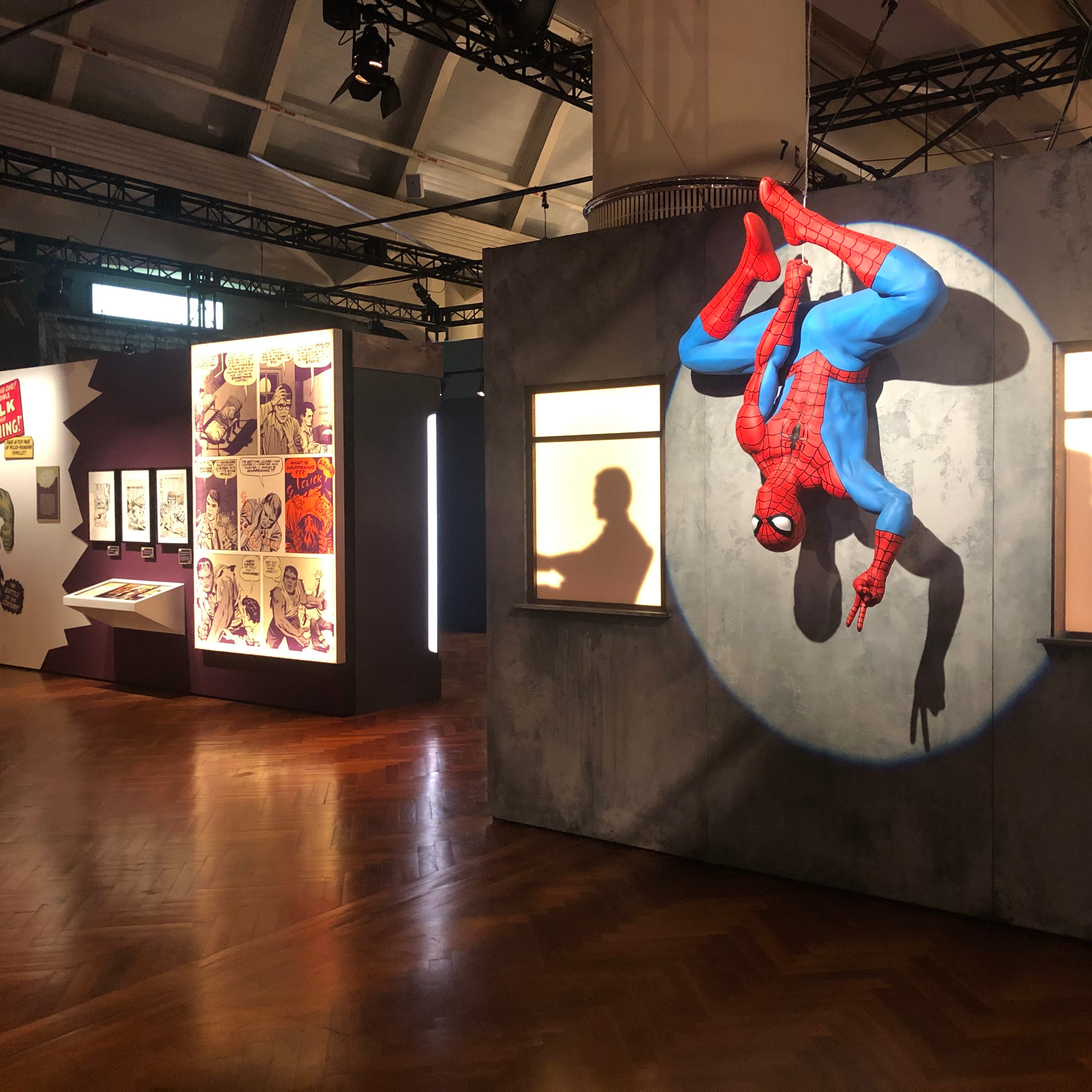 Spider-Man hangs out in a characteristic pose at the 'Marvel: Universe of Super Heroes' exhibition opening July 16, 2020 at the Henry Ford Museum in Dearborn.