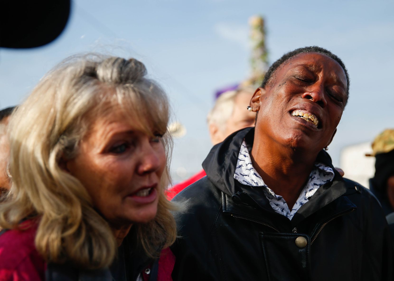 Rhonda Carrington (right) and Jennifer Birdd cried during Pastor Jeffery Parker's speech about S.O.U.L. Church having to move from the downtown Dallas lot on Dec. 8, 2019.