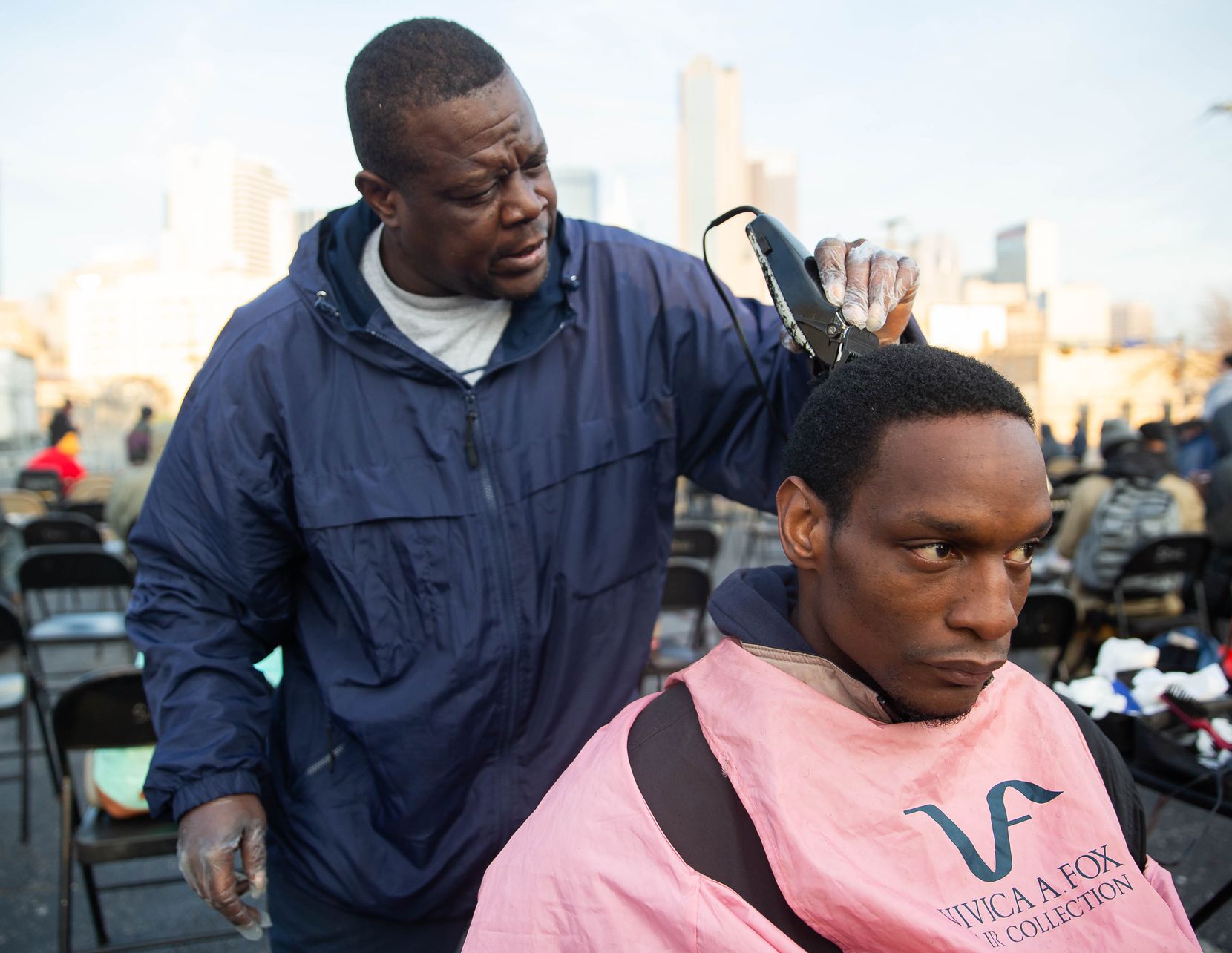 Isaac Bell (left) cut John Crawford's hair at S.O.U.L. Church on Dec. 8, 2019. Bell said he volunteered at the church because he loves the Lord.