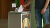 a man standing in front of a refrigerator: Polls open in Belarus presidential vote