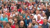 a group of people standing in front of a crowd: The EU has rejected the result of the disputed Belarus election, saying President Alexander Lukashenko's victory was neither free nor fair, and warns fresh sanctions against his government are imminent. The strongman leader of Belarus Alexander Lukashenko has since ordered the government to prevent further unrest over his claim to victory and to protect the ex-Soviet country's borders.