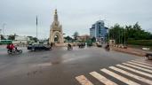 a group of people riding motorcycles on a city street: Morning traffic on Independence Square, a site of opposition protests in the Malian capital of Bamako, after a military coup which overthrew embattled President Ibrahim Boubacar Keita. IMAGES