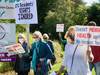 Dozens of people took to the streets in Wolfville to demand change for families with loved ones living in long-term care homes.